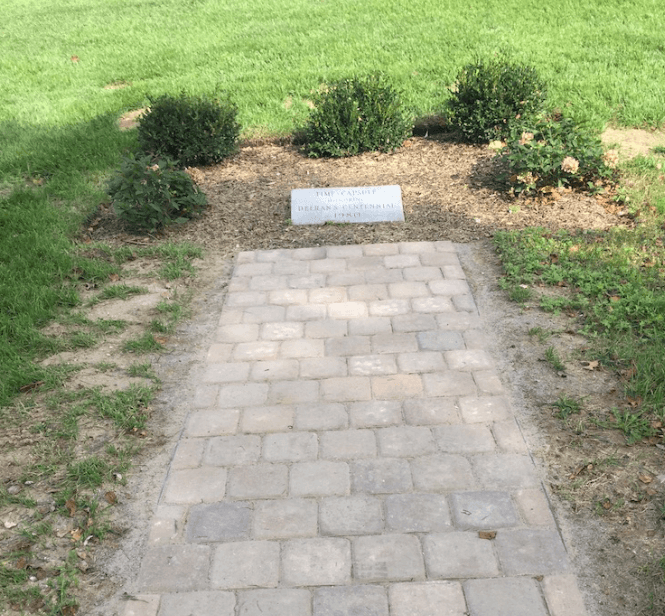 A Stone Laid Pathway With Grass Border